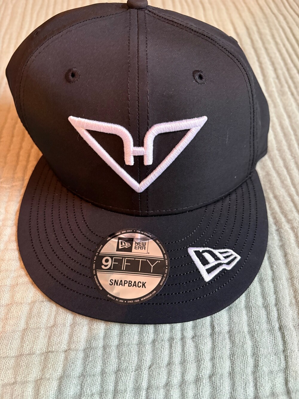 New Era 9FIFTY Black Snapback Hat White Embroidered Logo Flat Bill Cap